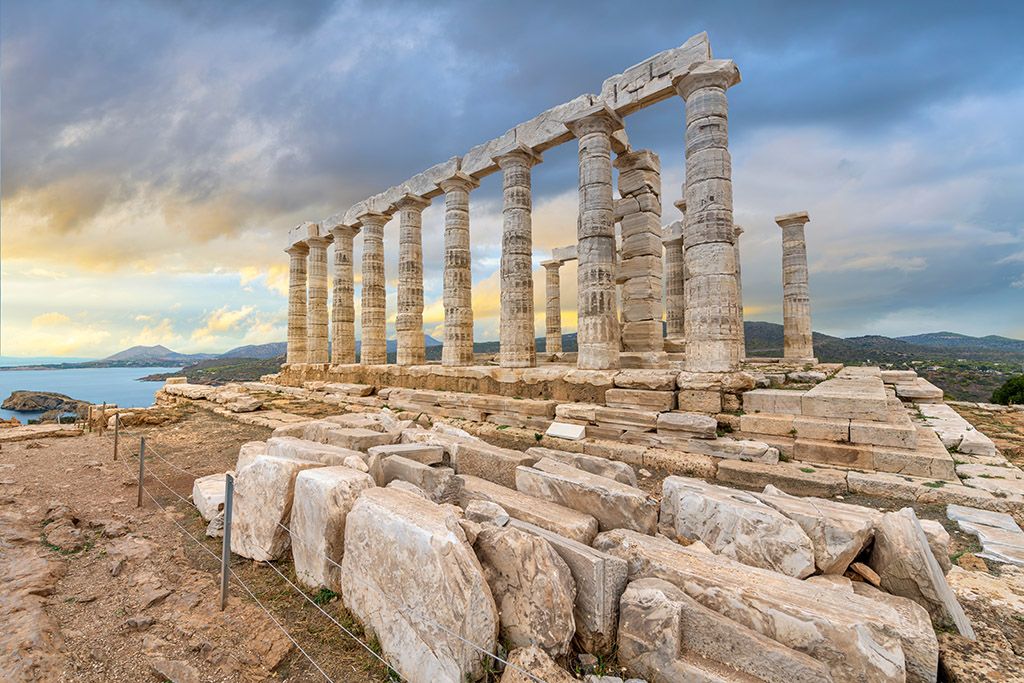A scenic photograph of an ancient Greek temple